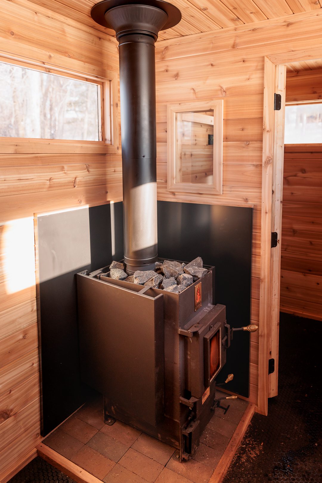 Kuuma stove in a Voyageur Mobile Sauna inside the Thousand Lakes Rental sauna