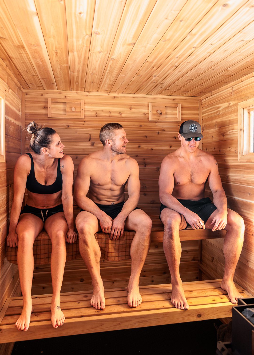 Sitting on the sauna bench in Minnesota inside a rental sauna during winter.