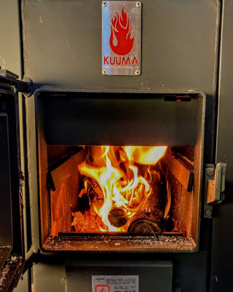 Sauna Temperature as an Art: Balancing Heat, Humidity, and Comfort in a Finnish Sauna 1 Reaching sauna temperature with a Kuuma wood-fired stove with a fire in it.