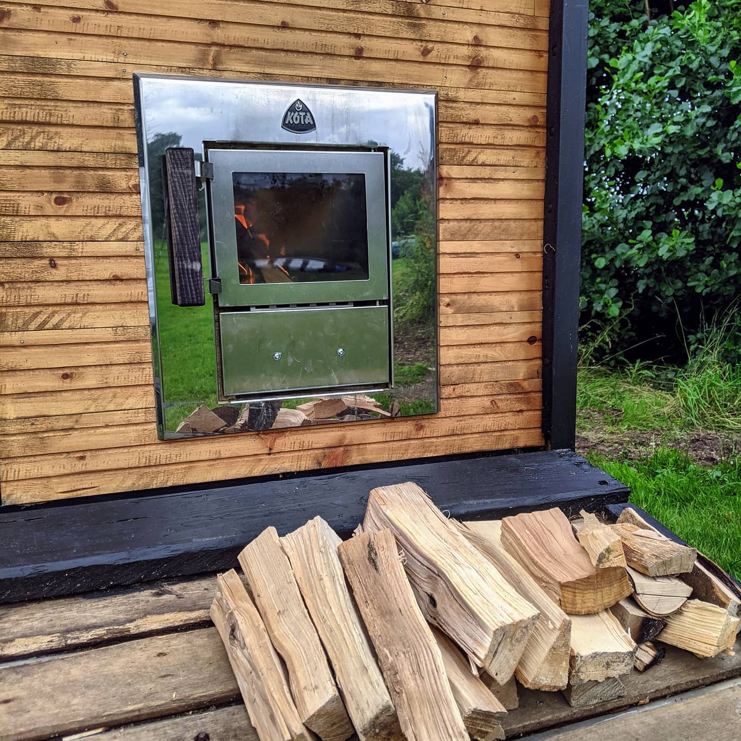 koa outside feed woodstove on rental sauna