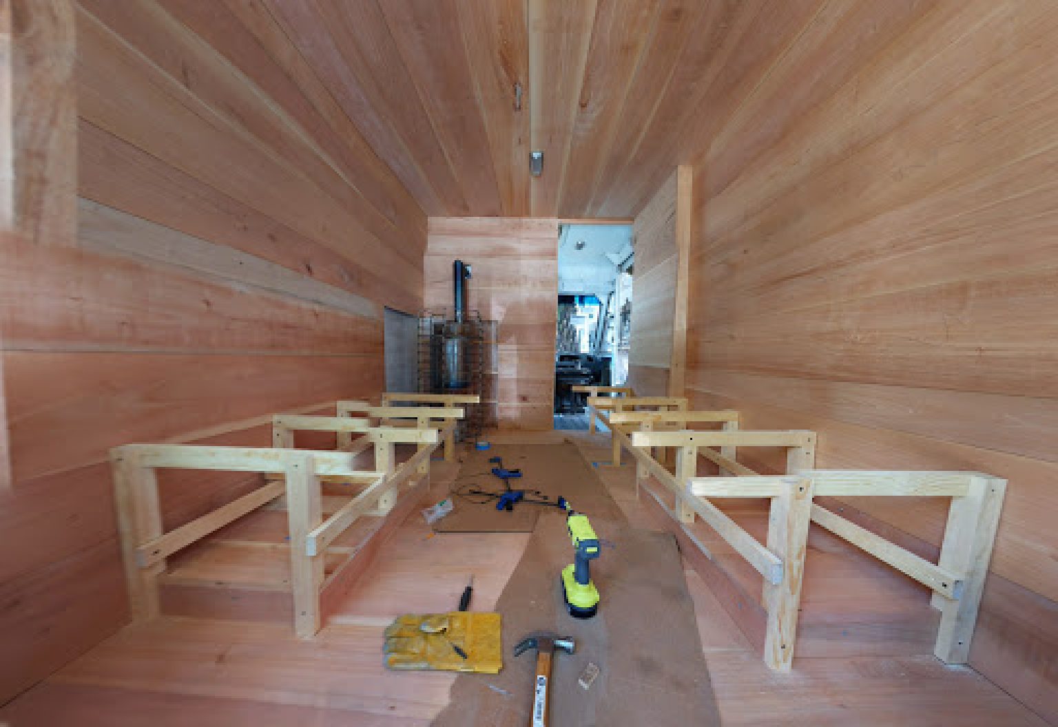 Building the sauna benches in a mobile sauna in Mexico City