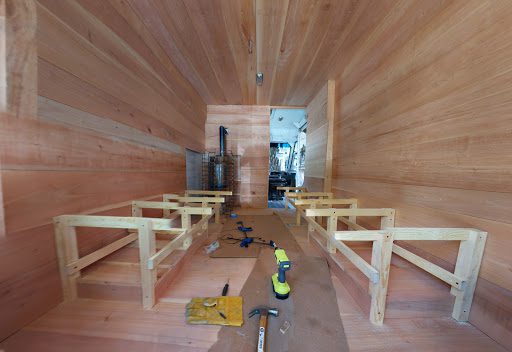 Building the sauna benches in a mobile sauna in Mexico City